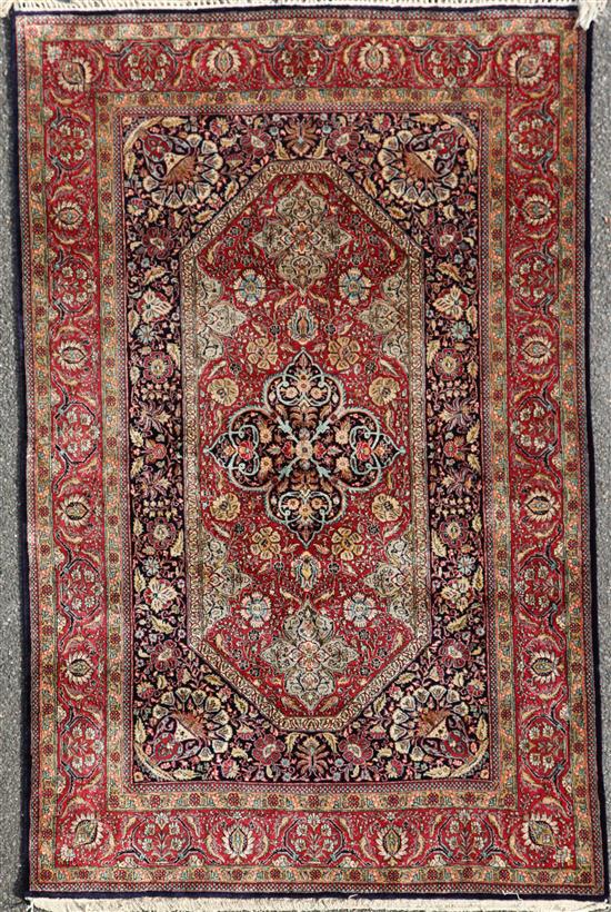 A Persian part silk Qum rug, 6ft 9in by 4ft 5in.